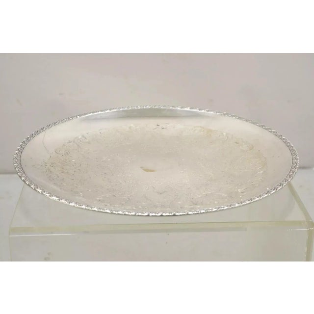 Vintage WM Rogers 767 Victorian Style Round Silver Plated Serving Platter Tray. Circa Mid 20th Century. Measurements: 1" H...