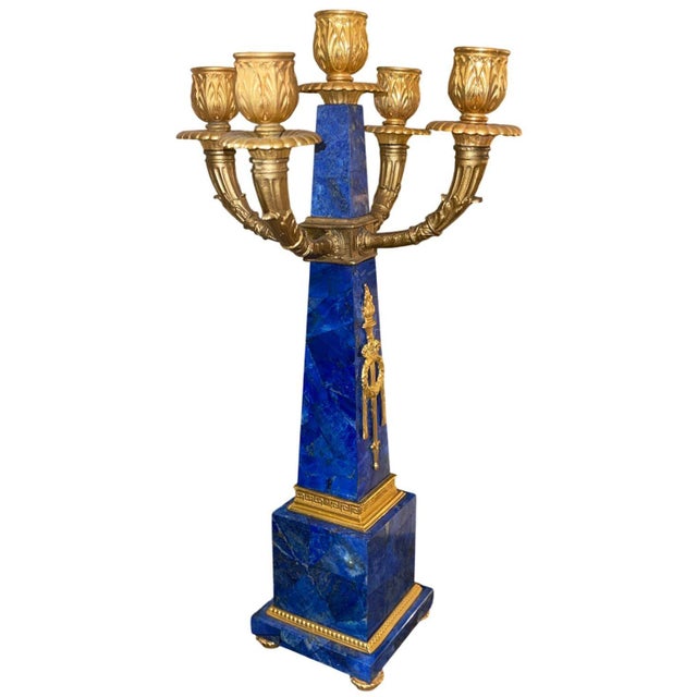 A magnificent pair of early 20th-century French candelabras, exquisitely crafted with lapis lazuli obelisks and adorned...