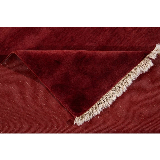 Beautiful antique Chinese Art Deco rug, hand-knotted wool with a red field, and a multi-color accents in a subtle all-over...