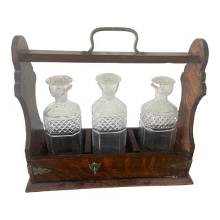 1910s English Oak Arts & Crafts Bareware Caddy Lockable Tantalus With Three Crystal Decanters For Sale