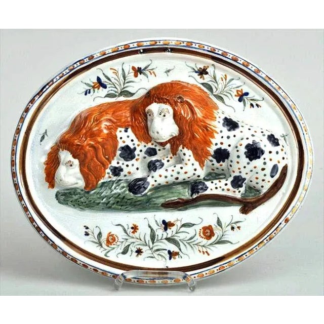 The Majestic and the Mundane: A Prattware Plaque of Folky Lions This oval Prattware pottery plaque, dating from the...
