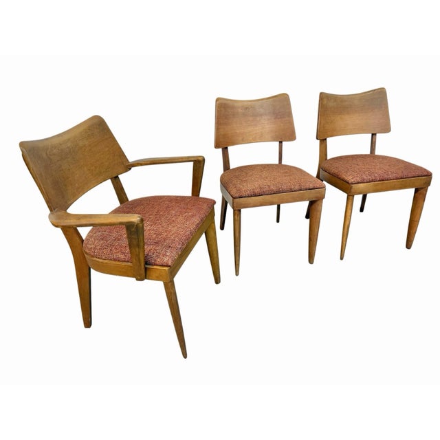 Bring authentic American Mid-Century Modern style to your dining space with this set of four Heywood-Wakefield maple...