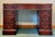 Gorgeous mahogany regency style writing desk by Colonial Manufacturing. Gold embossed brown leather three section top....