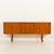 This scandinavian mid-century sideboard comes from the 1960s and is reminiscent of designs by nils jonsson. It combines...