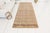 This is a vintage Turkish Oushak rug from the Mid 20th Century. The piece was hand-knotted.