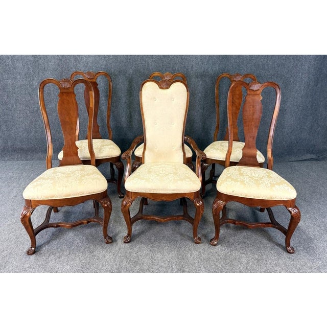 This set of six Bernhardt high back cherry dining chairs features elegant carved backs, cabriole legs, and upholstered...