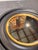 Make a statement with this bold circular mirror, designed in a sleek contemporary style. The wide black frame creates...