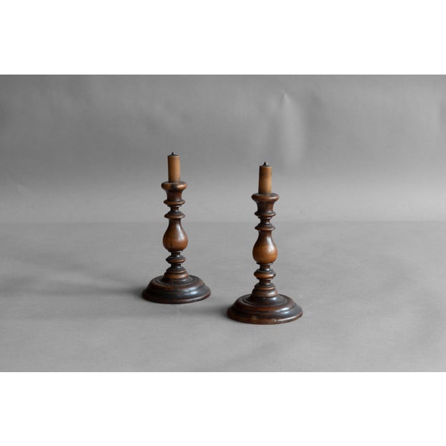 Pair of decorative turned fruitwood candlesticks. Circa 1800.
