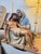 This religious sculpture represents the Virgin Mary holding Jesus in the traditional Pietà composition, capturing a moment...