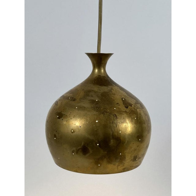 Organic shaped, elegant and highly decorative mid-century modern brass pendant lamp or hanging light 'löken' or 'onion'....
