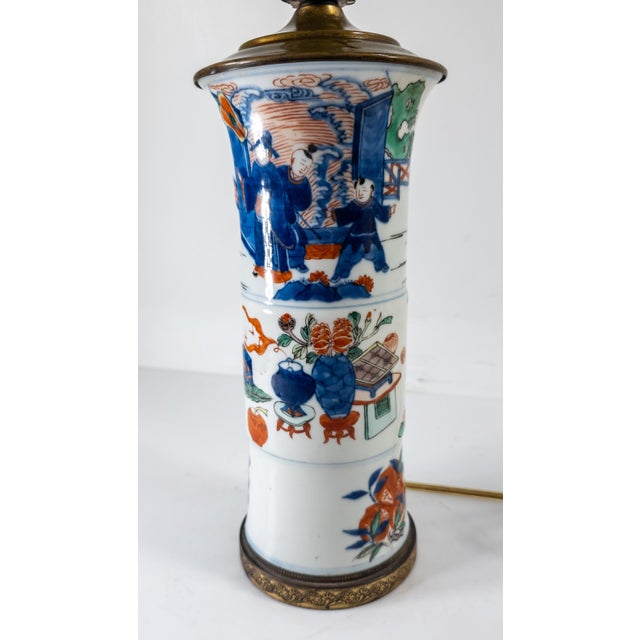 We are selling this beautiful Chinese 19th century gu form garniture vase mounted as a lamp. This vase has Wucai palette...