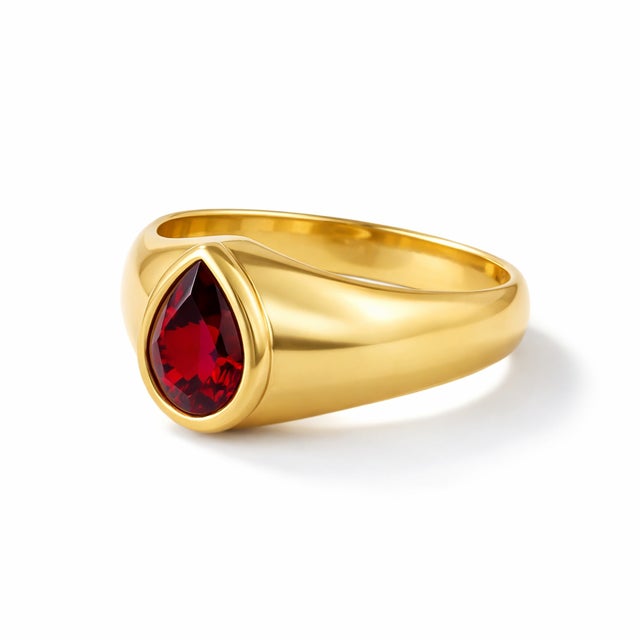 Make a bold yet timeless statement with this elegant gold garnet ring, designed for those who appreciate refined...