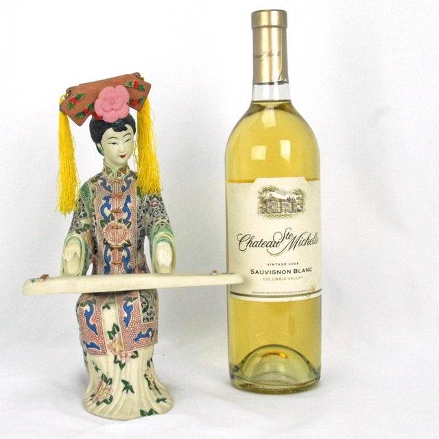 A vintage Chinese Shiwan Wucai (five-color) porcelain figurine of a court lady or noblewoman playing a traditional guqin...