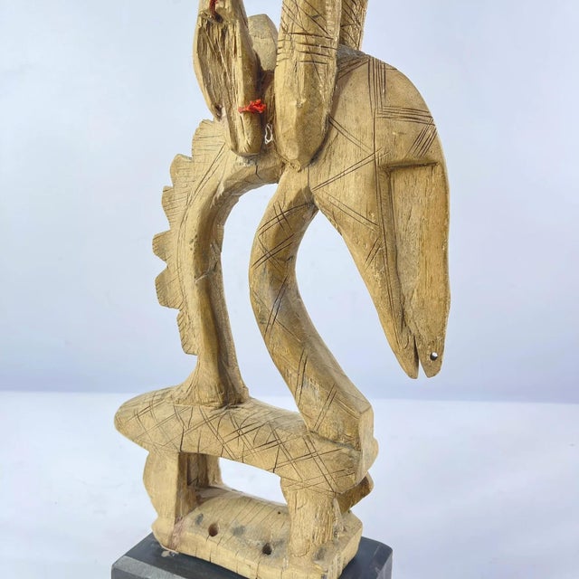 A lovely Chi Wara Headcrest from the Bamana people of Mali, on a custom base. The Bamana, also known as Bambara,...