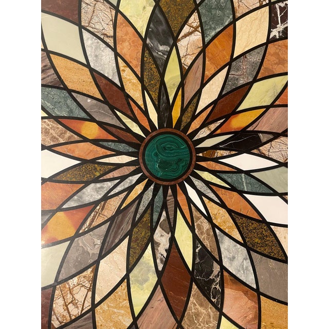 Impressive early 20th century Italian pietra dura marble center table featuring a striking geometric flower-form top with...