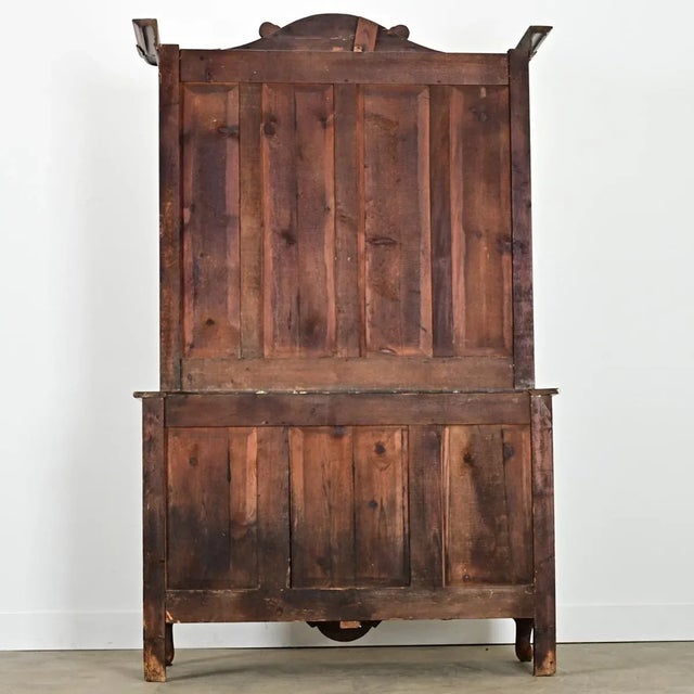 A captivating buffet à deux corps from the Louis XV period (18th century) made of finely-grained, solid pine that glows...