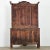Dimensions: 91 ⅝” H x 55 ⅜” W x 20 ⅜” D A French solid pine carved armoire from the Louis XV period, with stylized bonnet...