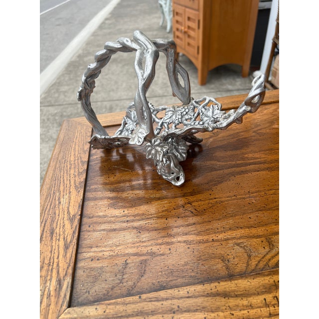 King Arthur’s Court Aluminum Wine Bottle Holder with Leaves and Vines Motif.