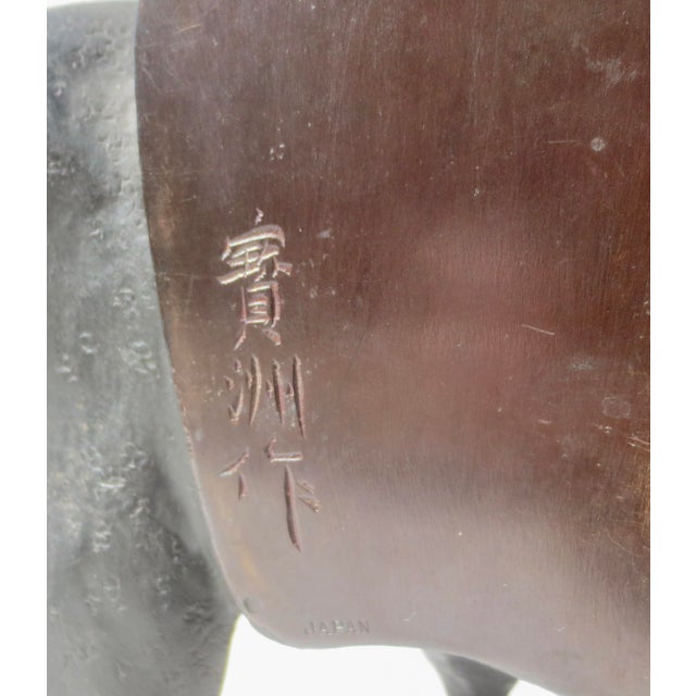 Signed bronze with script characters and the JAPAN mark for export on the back of the heads. Taisho period. 1912-1926 The...