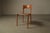 A distinctive set of five Italian dining chairs dating from the 1990s, combining a light-toned wooden frame with cognac...