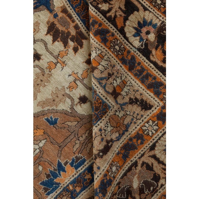 A late 19th century antique Persian Tabriz rug, the cocoa field with four ivory cartouches and a palmette and floral vine...