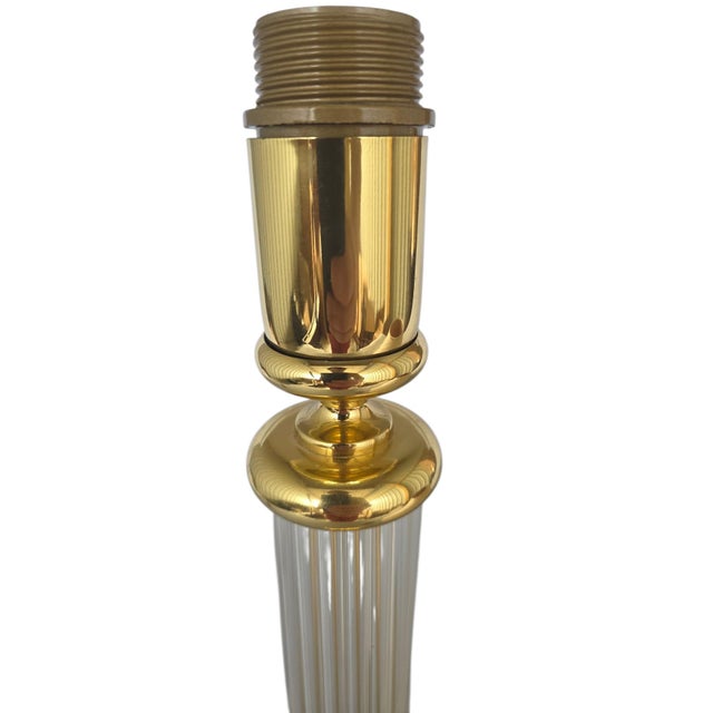 Elegant vintage table lamp from the French manufacturer Le Dauphin. The base consists of a heavy, square brass plinth...