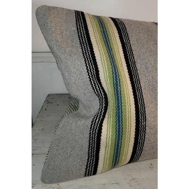 Mexican Serape wool pillow with unusual green and brown color pallets. We chose a soft green backing to compliment this...
