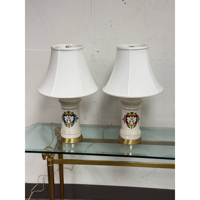 Design Plus Gallery presents a Pair of Ceramic Apothecary Vintage Column Table Lamps. Each lamp pairs a glossy white...