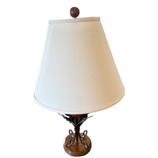 Charming pair of acorn-shaped table lamps featuring beautifully grained wood acorn bodies, surrounded by heavy wrought...