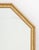 Hollywood Regency Giltwood and Faux Tortoiseshell Framed Beveled Glass Mirror, canted corners to the top. Mirror plate:...