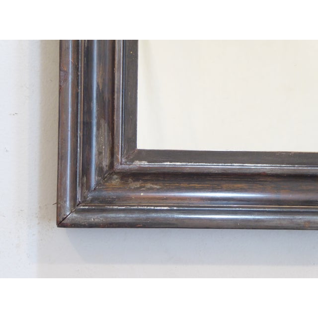 This dark silverleaf accent mirror has a dark pewter tone and measures 17.5"H x 16.25"W.