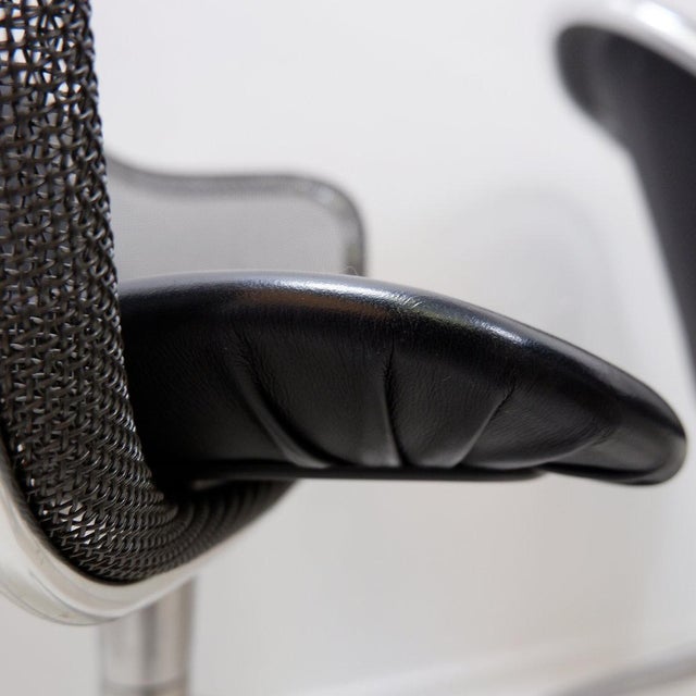 Dimensions: 63 x 56 cm - Height: 77 cm - Seat height: 44 cm - Armrest height: 64 cm Frame: Polished chrome-plated steel...