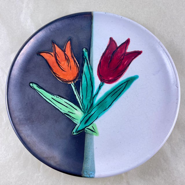From the Atelier Cérenne à Vallauris in France, a hand made pottery Tulip plate, circa 1940-1950. The plate is finished in...