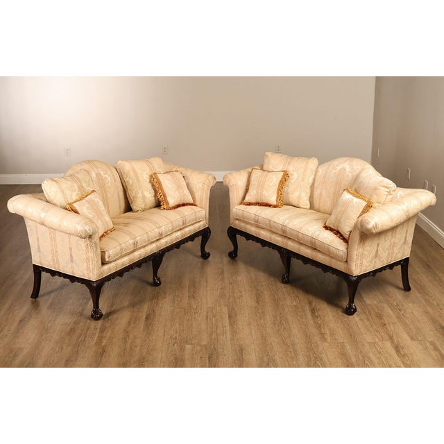 High Quality American Made, Custom Upholstered Pair of Mahogany Camelback Loveseats or Sofas with Carved Ball and Claw Feet