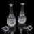 This is a pair of vintage spirit decanters. An English, cut glass liqueur bottle, dating to the late 20th century, circa...