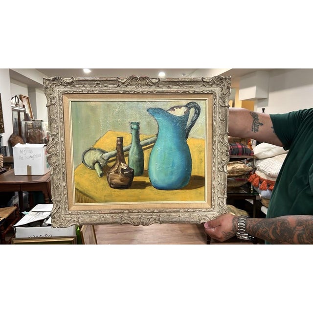 An expressive, painterly mid-century style still life oil painting featuring a vibrant turquoise pitcher, glass bottles,...