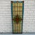 Antique architectural stained glass window panel in the Arts & Crafts style, centered by a striking amber eye bullseye...