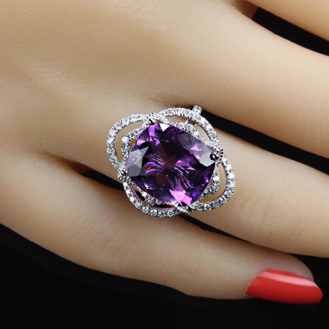 This is part of Chairish’s Fine Jewelry assortment. Stunning Cushion Cut Amethyst Cocktail Ring with Diamond Halo in 14K...