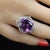 This is part of Chairish’s Fine Jewelry assortment. Stunning Cushion Cut Amethyst Cocktail Ring with Diamond Halo in 14K...