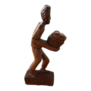Vintage Wooden Man Carrying Cotton Bale Carving