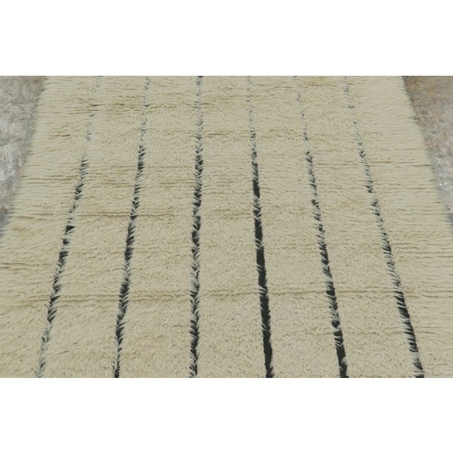 This 4x7 Scandinavian rug, hand-knotted in wool on wool foundation and dating to circa 1940, reflects an early dialogue...