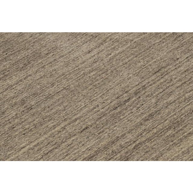 This 13x18 contemporary rug is the newest addition to the Rug & Kilim Textural Collection, with an inventive take on solid...