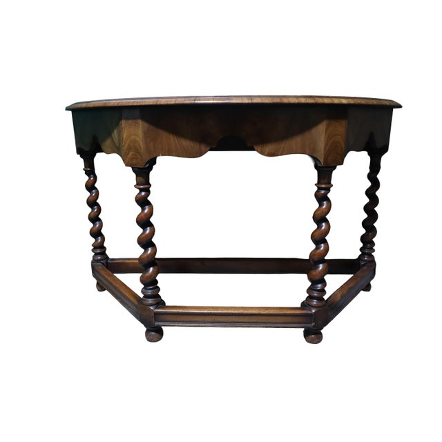 Beautifully constructed antique Jacobean style hallway table. Crafted out of walnut wood and decorated with a floral motif...