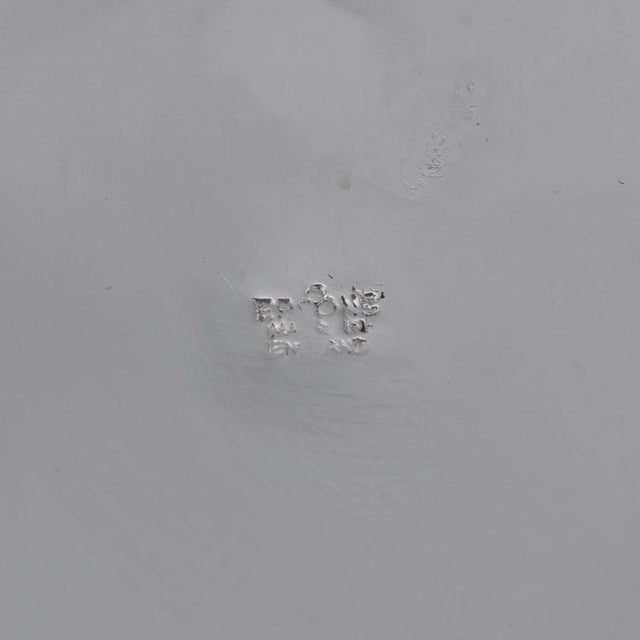 A charming 20th century english art deco silver plated cocktail shaker. Exquisite in its craftsmanship, the cocktail...