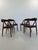 Set of 4 dining chairs. This elegant yet sturdy chair with a dark teak wooden frame and black skai upholstery makes a very...