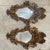 Two mirrored mirrors, each mounted in a composite frame crafted as foliage accented by lion's heads and puttos. CIRCA:...