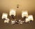 Large Vintage 1970s Kaiser Pendant Light, featuring an unusual design with eight intertwined curved chrome spokes,...