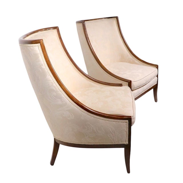 Voguish, chic, and stylish pair of scoop back, gondola style occasional, or lounge, upholstered chairs, with exposed wood...