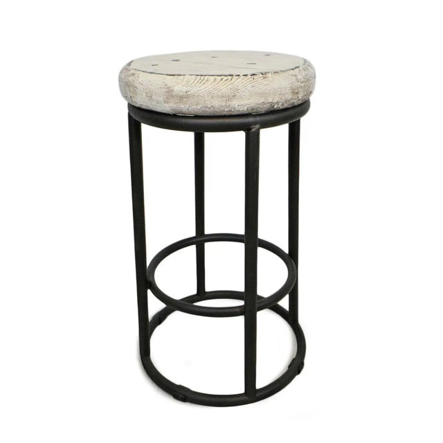 Round black iron base counter stool with distressed painted white salvaged wood top. Each slightly wonderfully unique in...