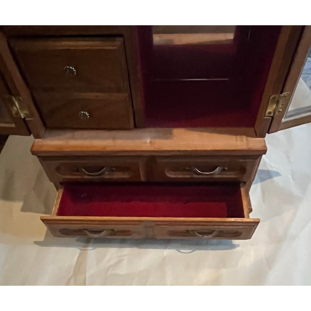 Beautiful solid wood vintage jewelry box that looks like a miniature armoire. 16 inches tall, 11 inches wide and 6 inches...